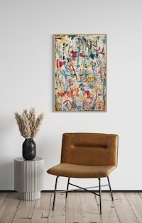 an abstract painting on a wall in a living room