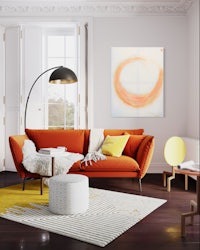 an orange couch in a living room